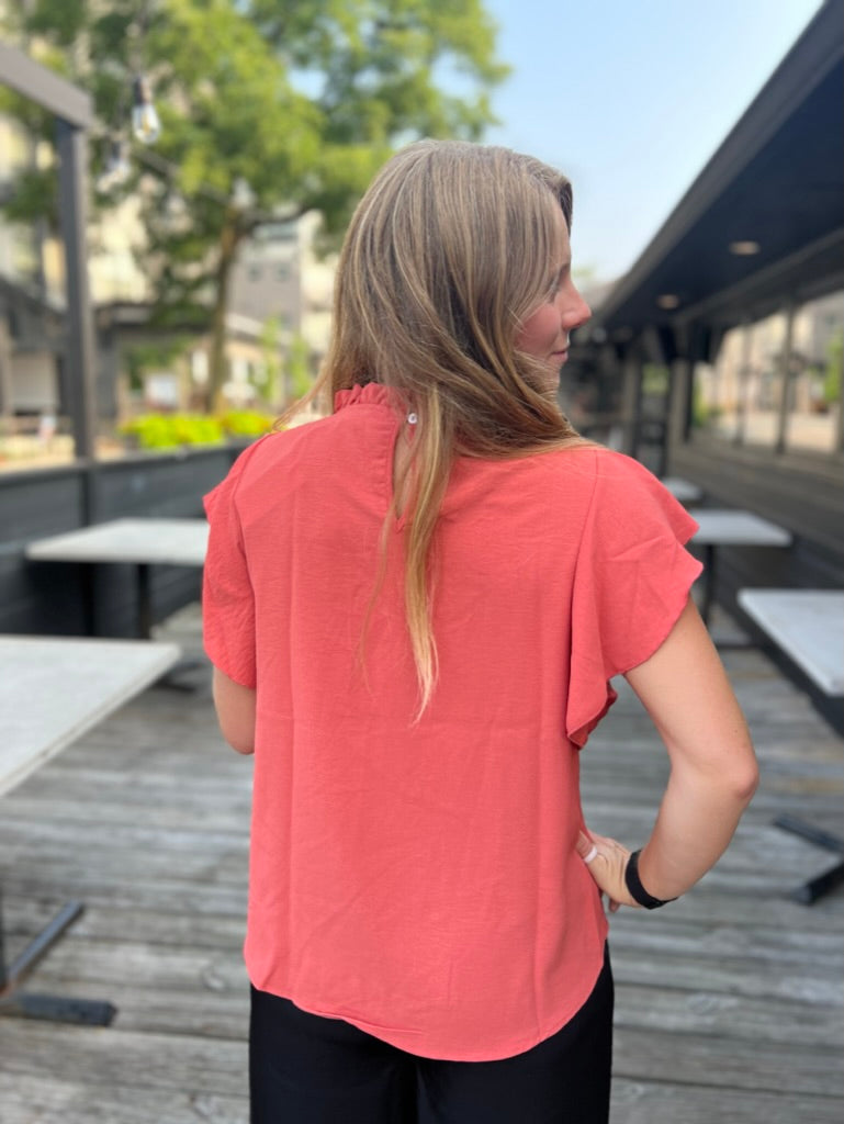 Stand out in Orange Ruffle Top